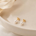 Petite Pearl Studs on cream ceramic